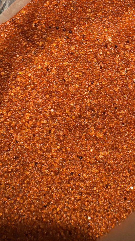 Rouhb fine red-orange granular powder texture, close-up view of 30g product showing shimmering crystalline surface