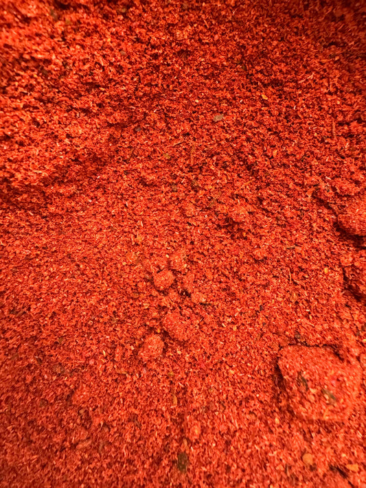 Vibrant red ground kefta spice blend Epices pour kefta showing fine texture and rich color detail
