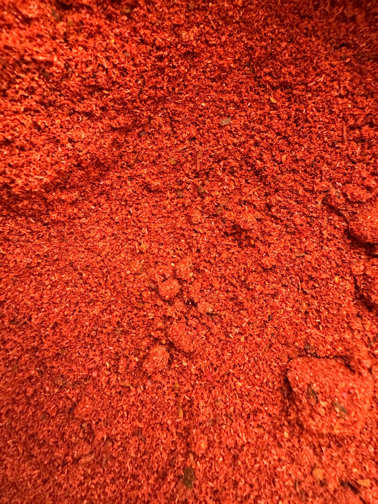 Vibrant red ground kefta spice blend Epices pour kefta showing fine texture and rich color detail
