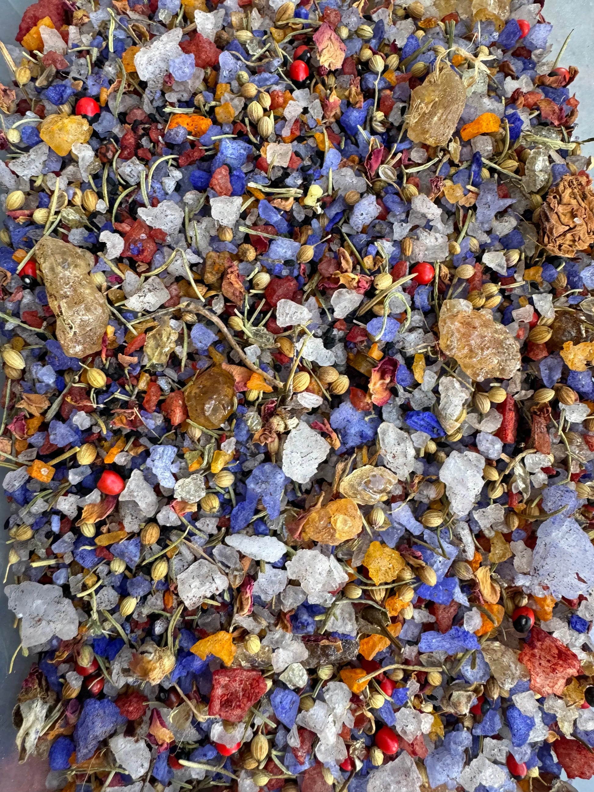 Tfoussikha egyptienne incense blend with colorful mix of blue, white, and red dried herbs, crystals, and resins for purification