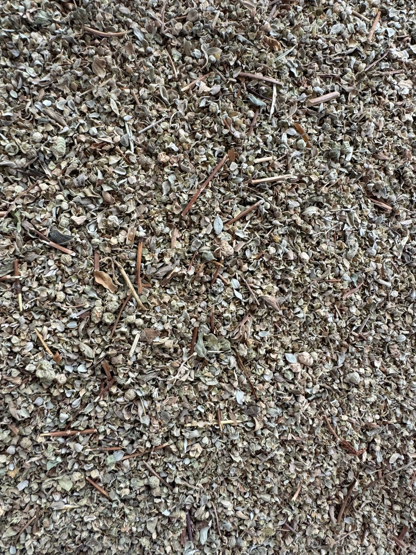 Dried Berdeqouch marjoram herb from Morocco, finely crushed leaves and stems showing natural texture and earthy tones