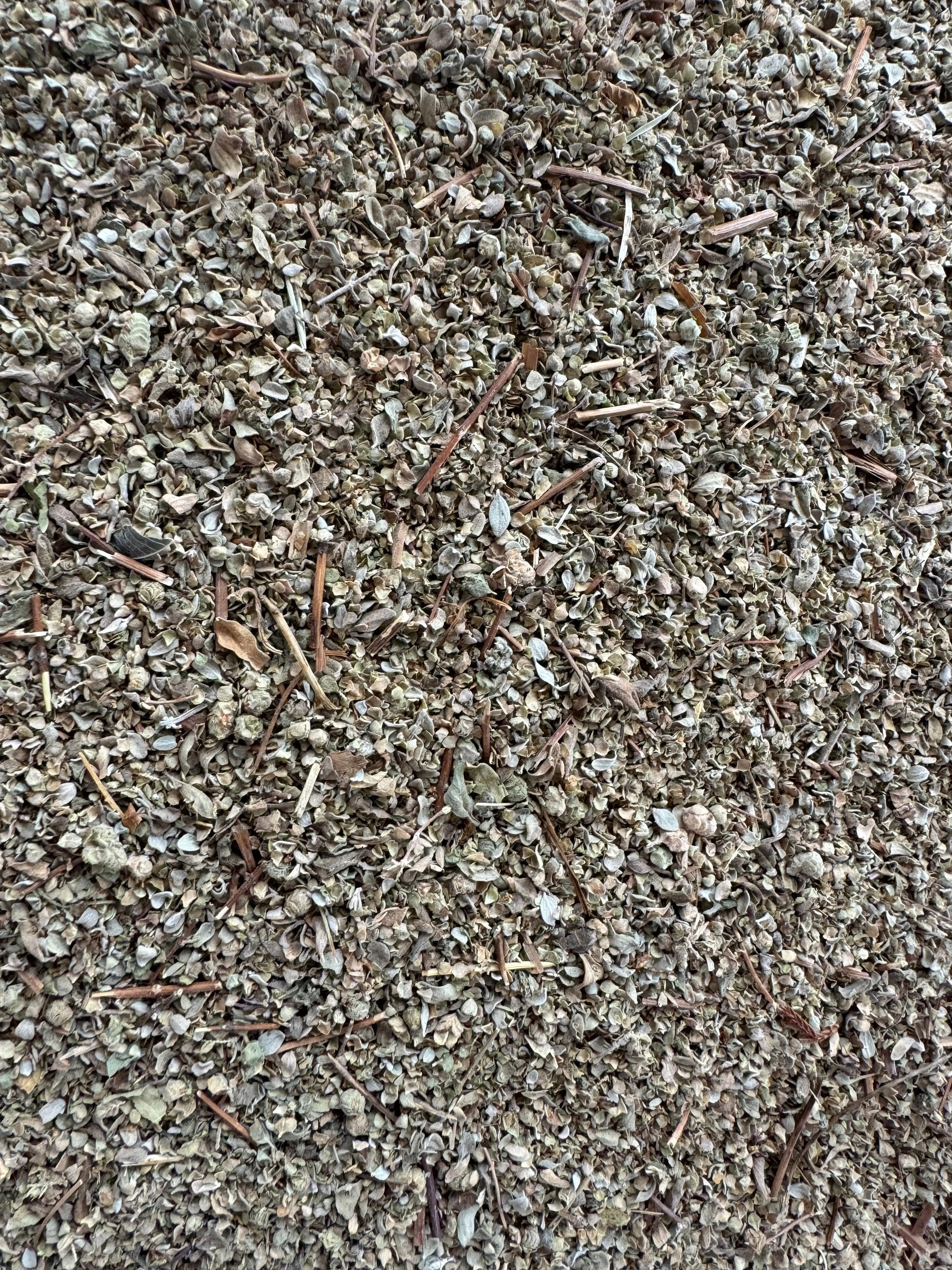 Dried Berdeqouch marjoram herb from Morocco, finely crushed leaves and stems showing natural texture and earthy tones