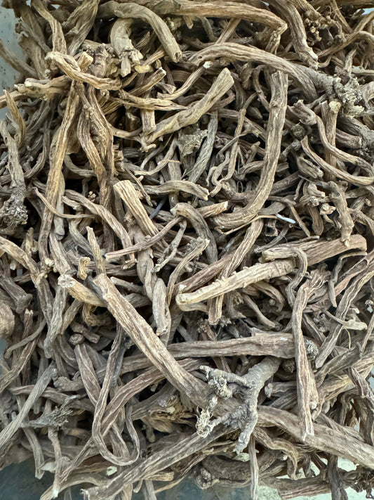Dried Serghina herbs from Morocco showing twisted, pale gray stems and leaves in their natural, dehydrated form