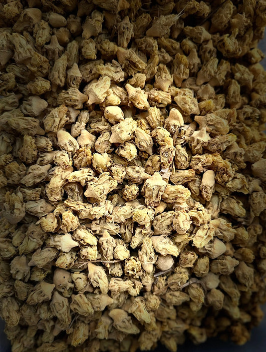 Dried Nouarat el karmouss herbs in golden brown color showing natural texture and clusters of traditional medicinal spice