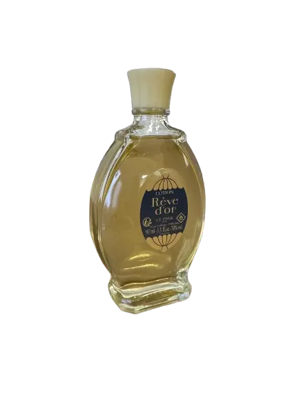 LT Piver Reve dor perfume lotion in elegant oval glass bottle with vintage label and cream-colored cap
