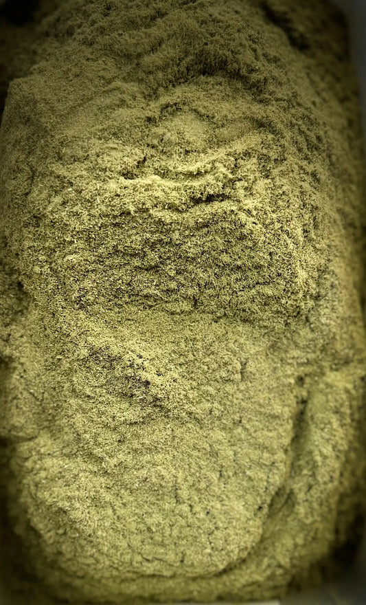 Close-up texture of El zaz herb powder showing fine, olive-green granules with natural layered pattern for 30g package