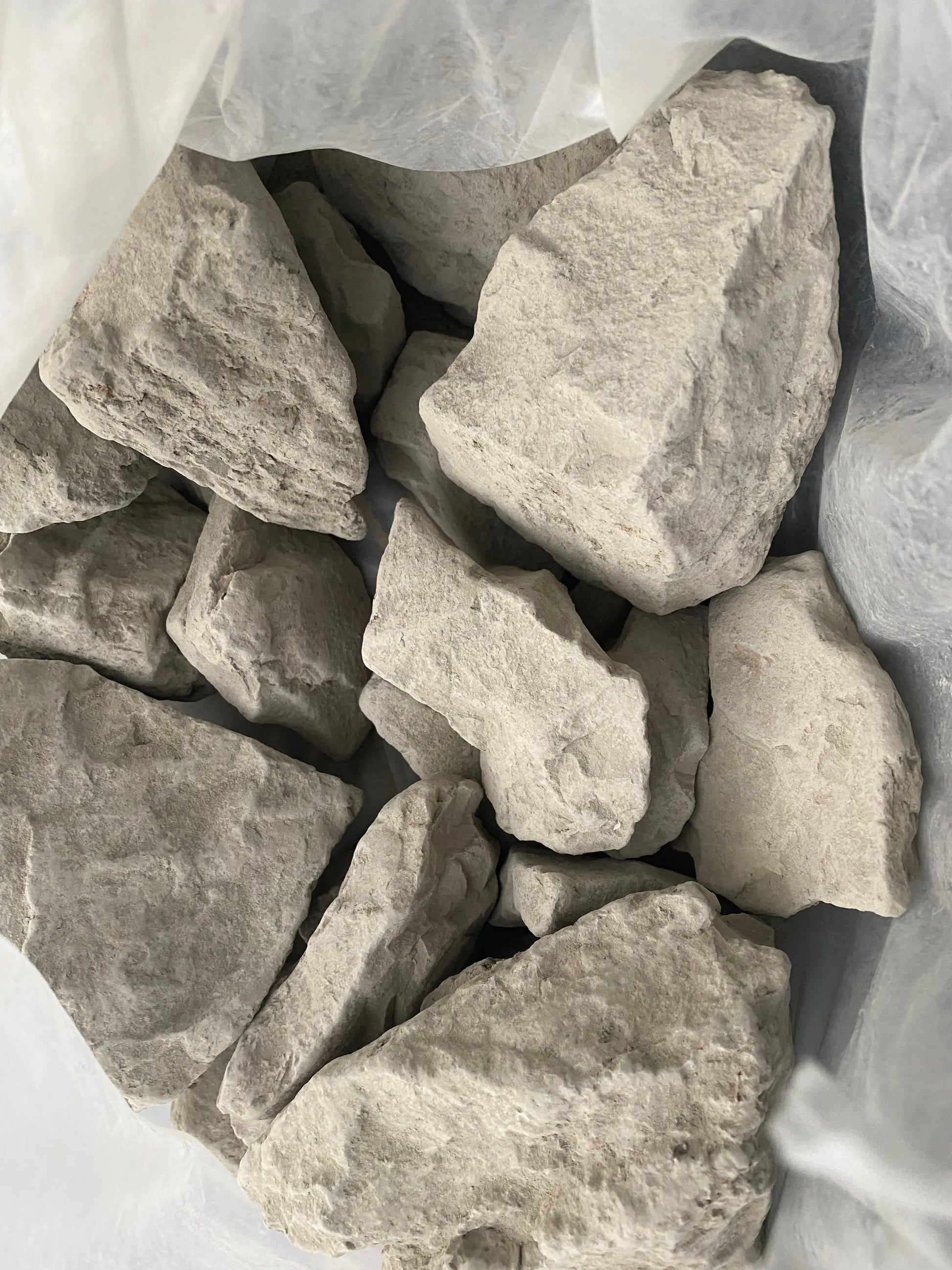 Natural Ghassoul clay chunks in light gray color for face and body care, 150g traditional Moroccan beauty treatment