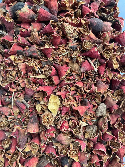 Rmimina dried pomegranate flowers in deep burgundy and brown colors, traditional natural remedy for oral health and hair care