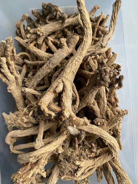 Dried Oud el msekhssekh roots and stems in natural beige color, showing detailed twisted and gnarled textures in close-up view