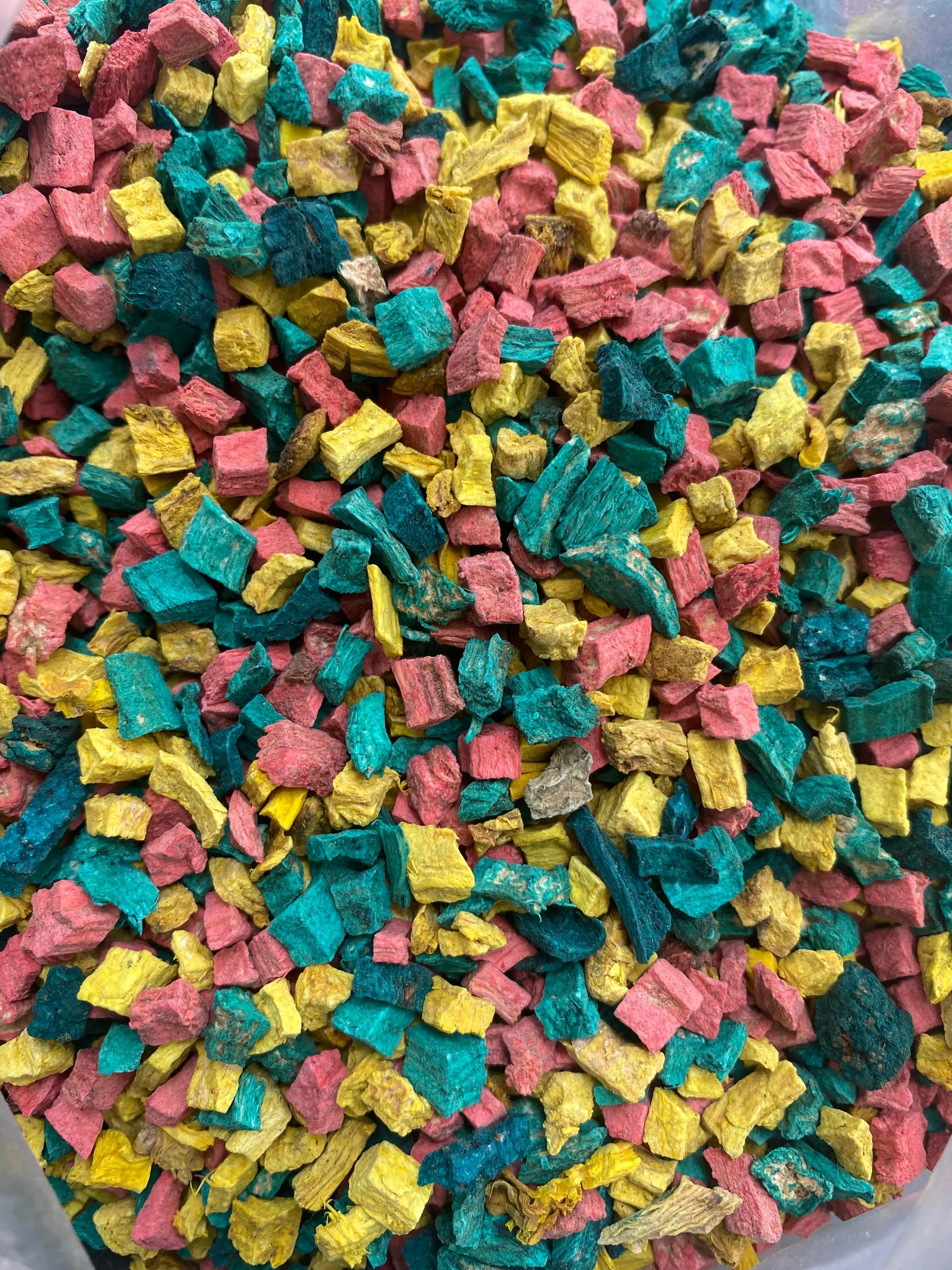 Colorful Serghina incense pieces in pink, yellow, and turquoise for traditional Moroccan aromatherapy and protection rituals
