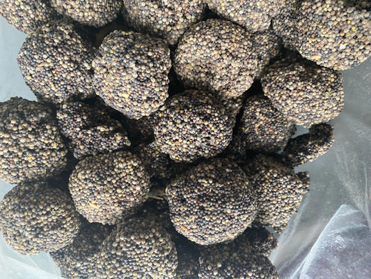 Hob El Machabek Chan al morchane traditional spherical sweets with tiny seed coating, clustered together in plastic bag