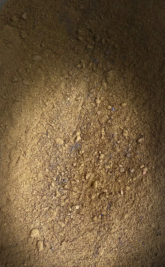 Tebrima traditional Moroccan herbal body powder blend with fine golden-brown texture and natural ingredients