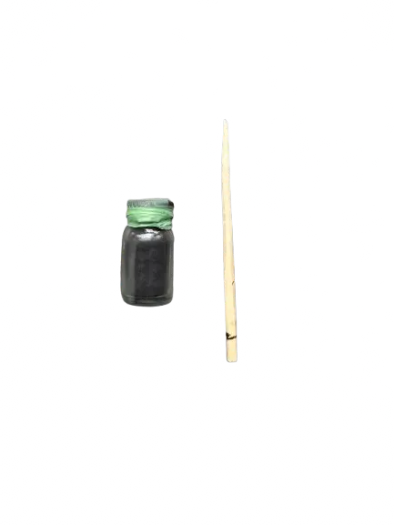 Traditional Moroccan Khol noir black kohl cosmetic powder in glass jar with wooden application stick