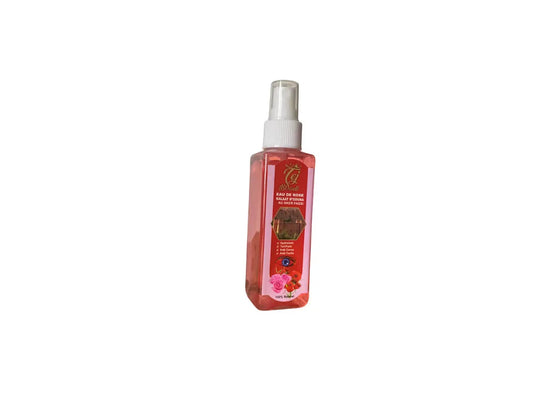 Clear spray bottle of Eau de rose a l'akkar fassi rose water, 100ml, featuring pink-tinted liquid and white spray nozzle
