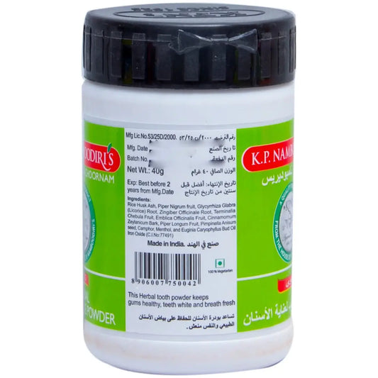 K.P Namboodiri's Herbal Tooth Care Powder 40g container with green label and black cap showing product information