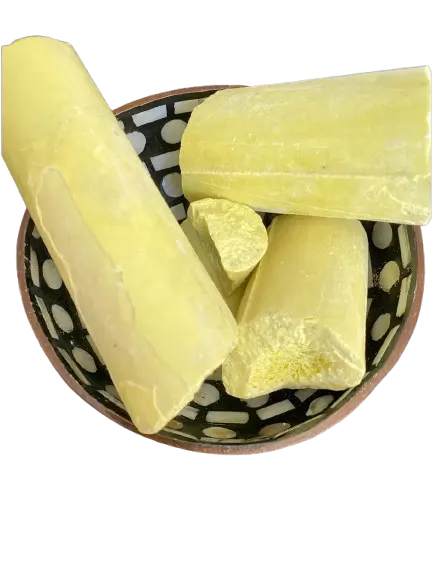 Yellow Kbrit asfar sulfur blocks in decorative bowl, natural protection against negative energies and for spiritual cleansing