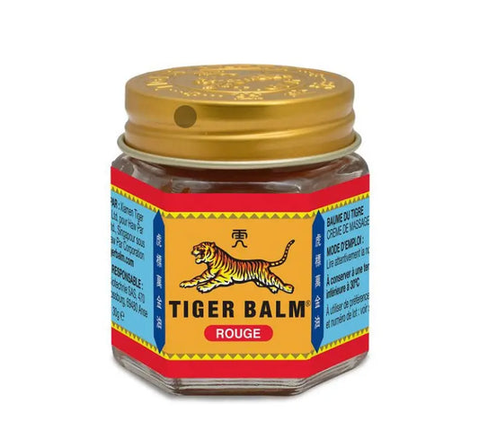 Tiger Balm Red ointment jar showing traditional packaging with tiger logo and gold cap on hexagonal glass container