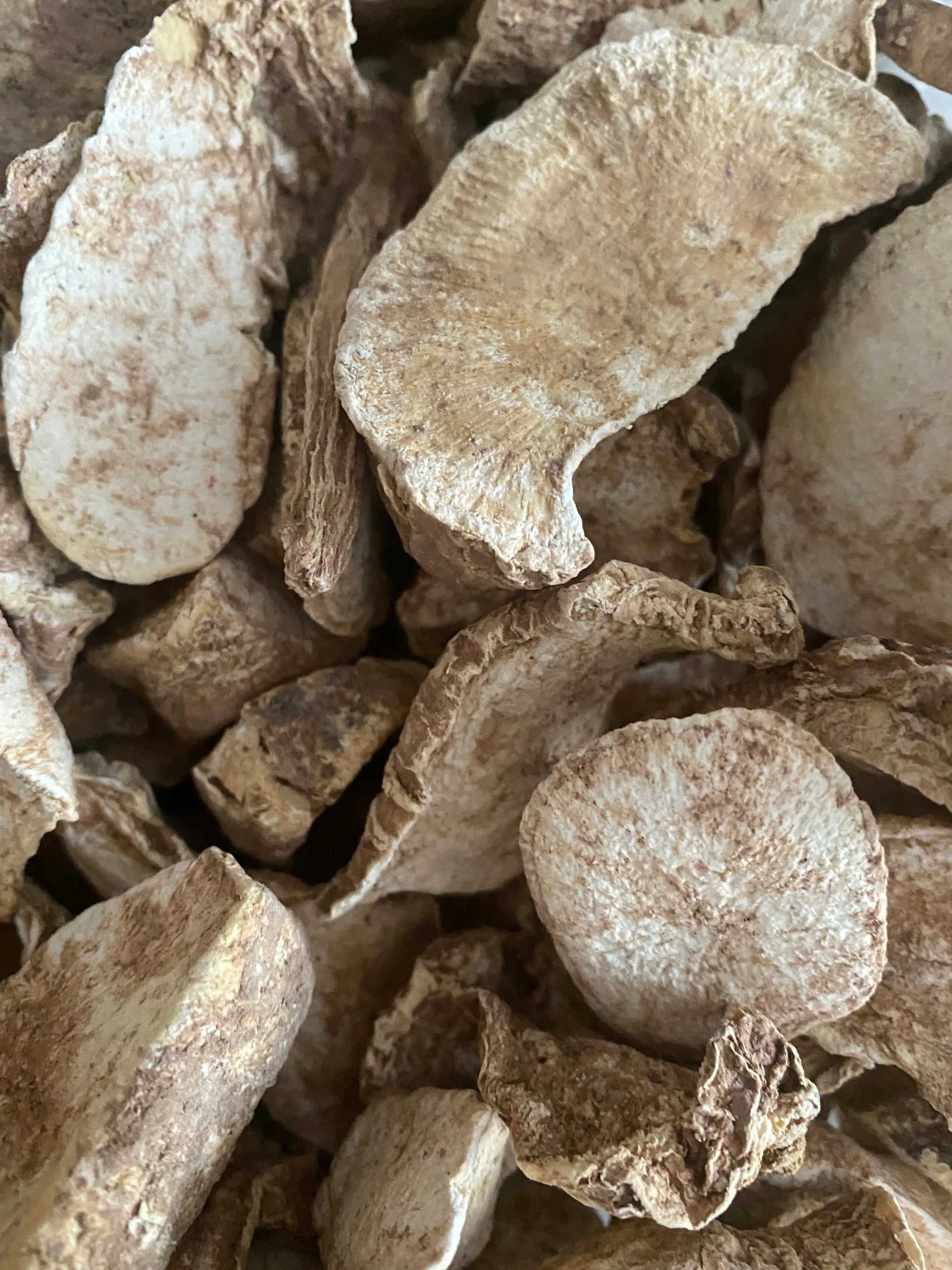 Beidh el ghoul dried mystical herbs in pale beige color, close-up view showing natural curved textured pieces for purification