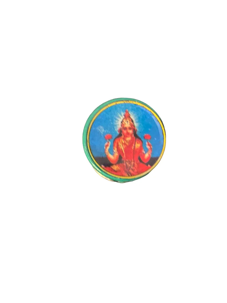 Small round tin of Afioune 3afioune 25g featuring a traditional religious illustration with turquoise border and golden accents against a white background. Product displays decorative circular artwork in vibrant red and blue tones.