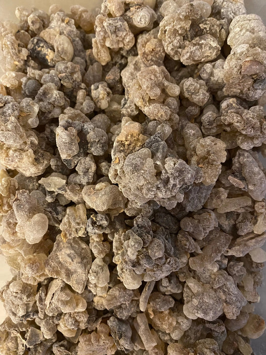 Premium Hojari Frankincense resin from Salalah Oman, natural beige chunks for burning incense, close-up view of aromatic crystals