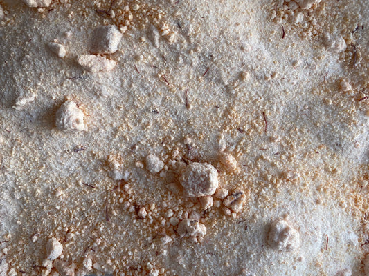 Turkish mango saffron tea powder mixture with white crystalline sugar particles and orange-tinted saffron threads