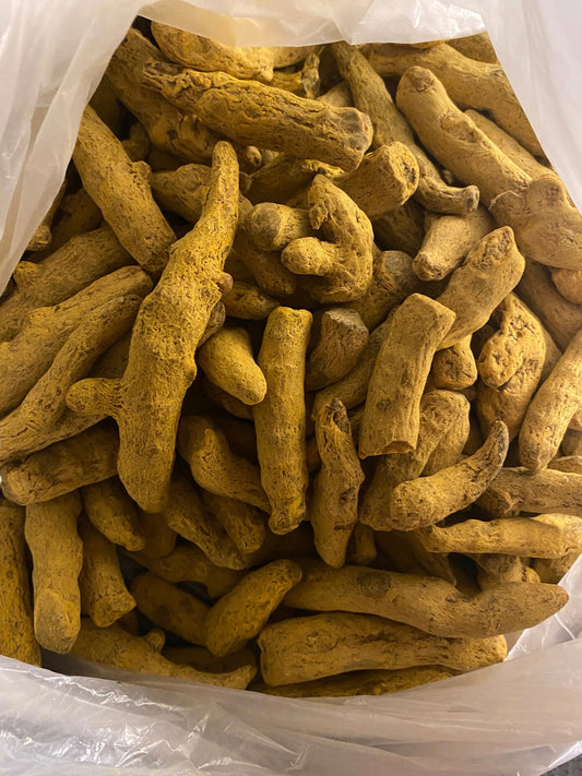 Fresh turmeric roots Curcuma 50g in clear packaging, showing natural golden yellow color and characteristic root shape