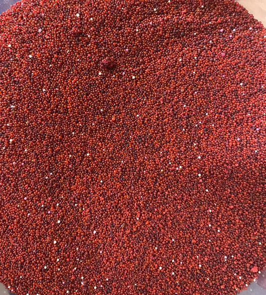 Close-up view of el r3ida rida rehida red granules showing uniform texture and vibrant color of traditional Middle Eastern spice