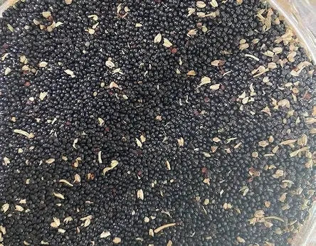 Sakta wa meskouta black seeds mixed with dried herbs in circular container for stress and anxiety relief