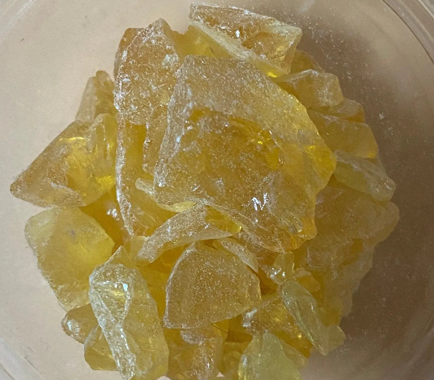 Oum El Nass el mor Myrrh resin crystals in golden yellow color displayed in clear bowl for spiritual purification