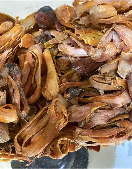 Dried Mace (Bssibssa) spice husks, reddish-brown in color, showing natural aril strips from nutmeg covering