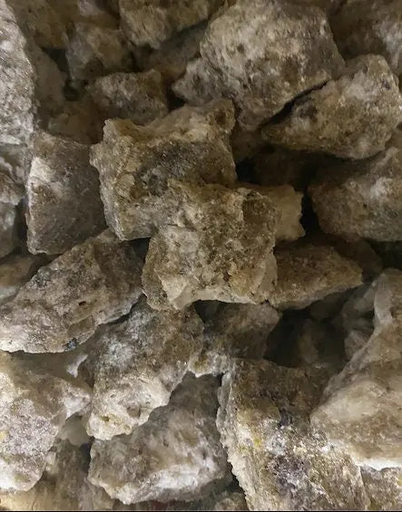 Raw chunks of White Benzoin resin (Jaoui Abyad) incense shown in natural crystalline form for purification and protection