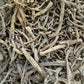 Dried Serghina herbs from Morocco showing twisted, pale gray stems and leaves in their natural, dehydrated form