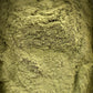 Close-up texture of El zaz herb powder showing fine, olive-green granules with natural layered pattern for 30g package