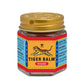 Tiger Balm Red ointment jar showing traditional packaging with tiger logo and gold cap on hexagonal glass container