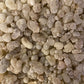 Premium Oliban hawjari frankincense resin crystals from Salalah, Oman, showing natural white and cream colored granules in detail