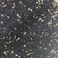Sakta wa meskouta black seeds mixed with dried herbs in circular container for stress and anxiety relief